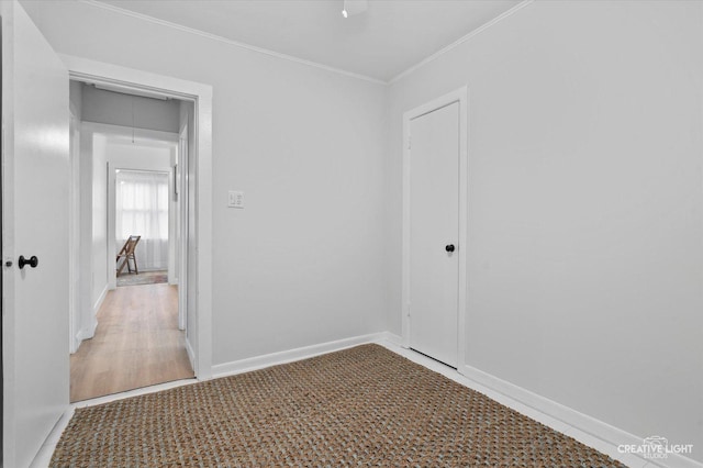 unfurnished room with ornamental molding