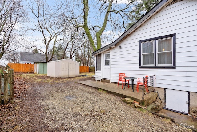 view of yard with a patio and a storage unit