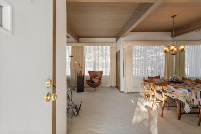 442 Wolfe Dr, Loda, IL 60948 - dining space featuring a chandelier, carpet, wood ceiling, and beamed ceiling