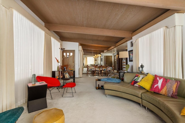 carpeted living room featuring an inviting chandelier, wood ceiling, and beamed ceiling