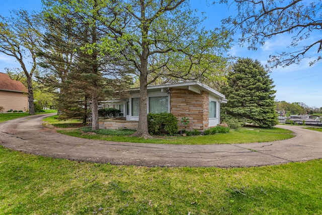442 Wolfe Dr, Loda, IL 60948 - view of property exterior with a lawn and stone siding