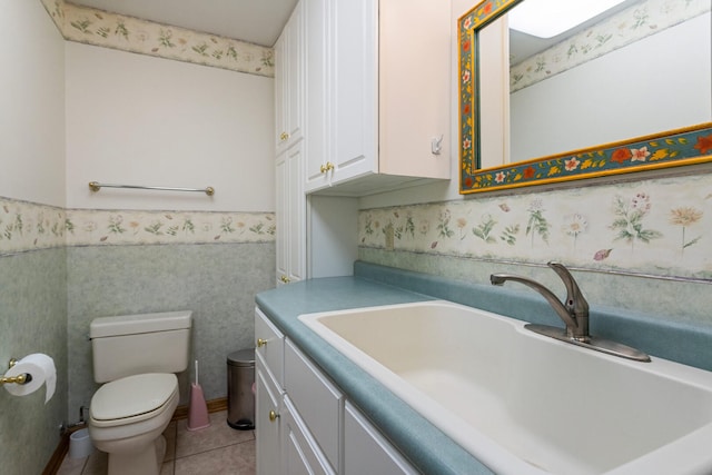 bathroom featuring vanity, toilet, and tile patterned flooring