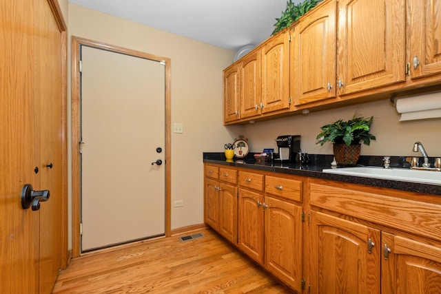 kitchen featuring light hardwood / wood-style floors and sink