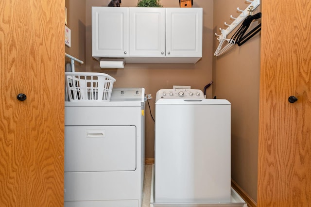 laundry area with cabinets and washer and dryer