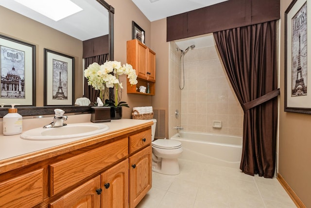 full bathroom featuring shower / bath combo, tile patterned floors, toilet, a skylight, and vanity