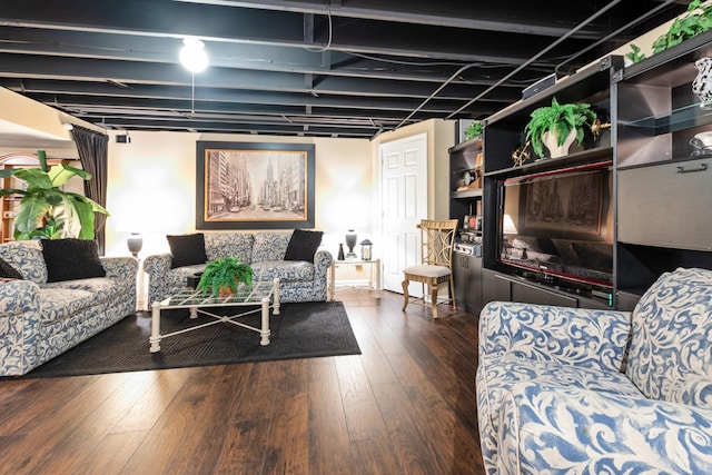 living room with dark hardwood / wood-style flooring