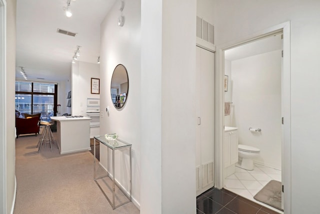 hall featuring tile patterned flooring