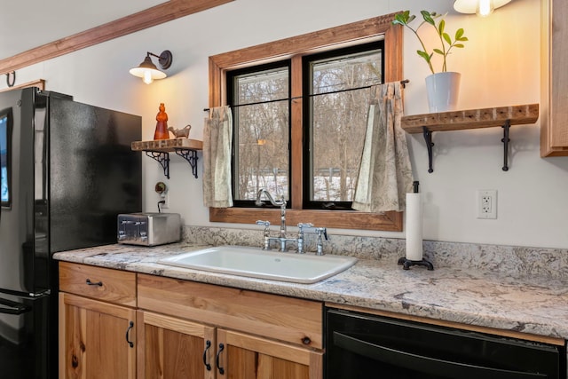 kitchen with sink and black appliances