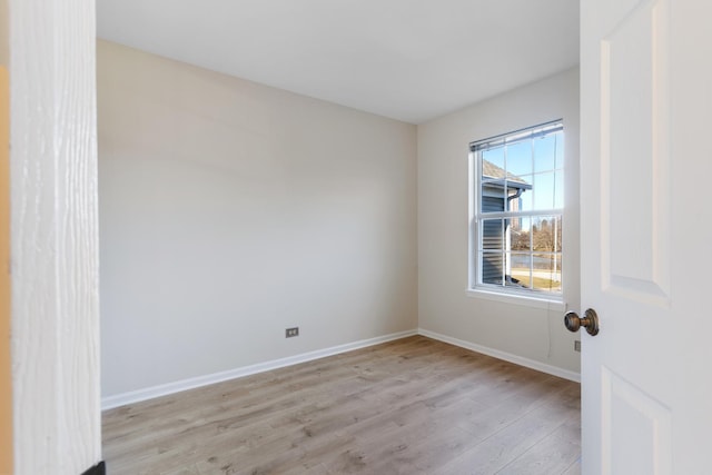 spare room with light hardwood / wood-style floors