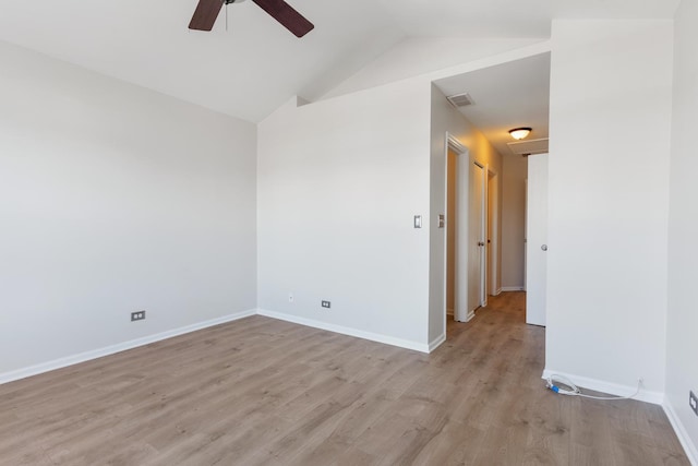 unfurnished room with lofted ceiling, ceiling fan, and light hardwood / wood-style flooring