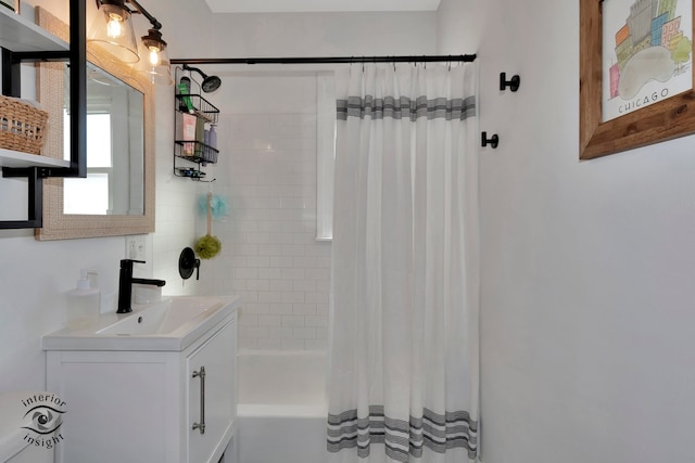 bathroom with vanity and shower / tub combo with curtain