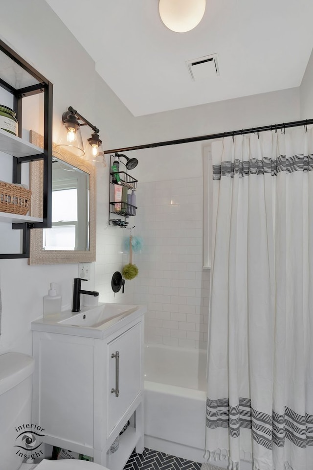 full bathroom featuring toilet, shower / tub combo, tile patterned floors, and vanity