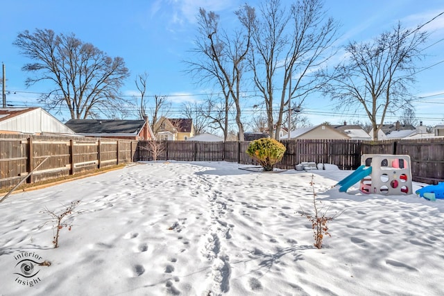 view of yard layered in snow