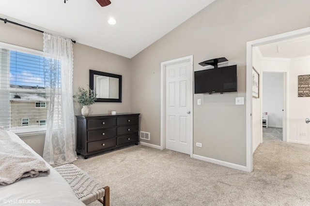 bedroom with ceiling fan, crown molding, vaulted ceiling, and light carpet