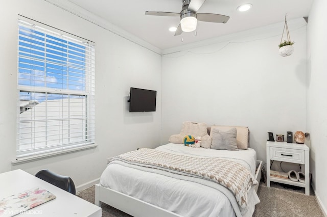 bedroom featuring ceiling fan, carpet, and ornamental molding