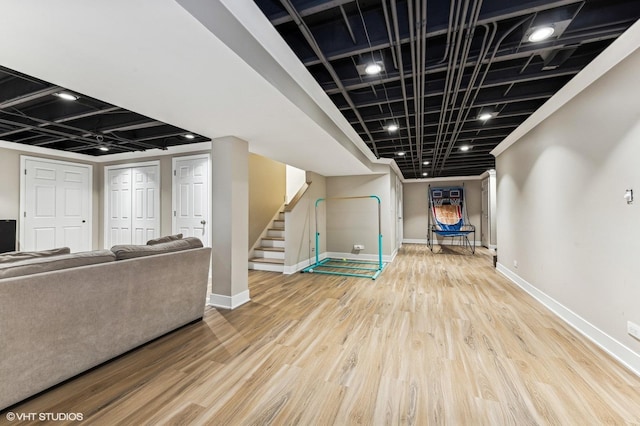 basement with hardwood / wood-style flooring