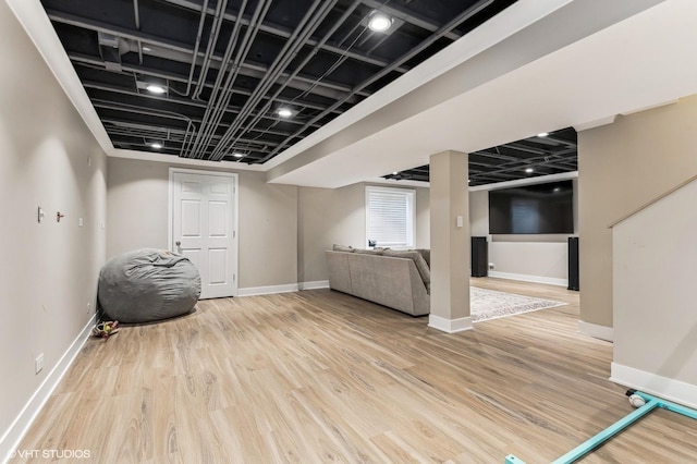 basement with hardwood / wood-style flooring