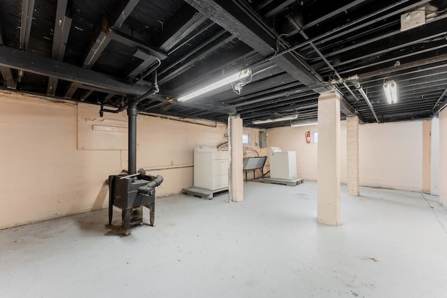 basement with washer and dryer and sink