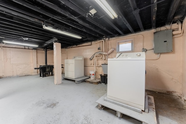 basement featuring electric panel and independent washer and dryer