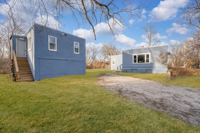 view of property exterior with a yard