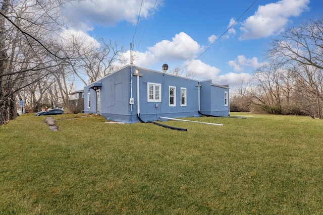 rear view of house with a lawn