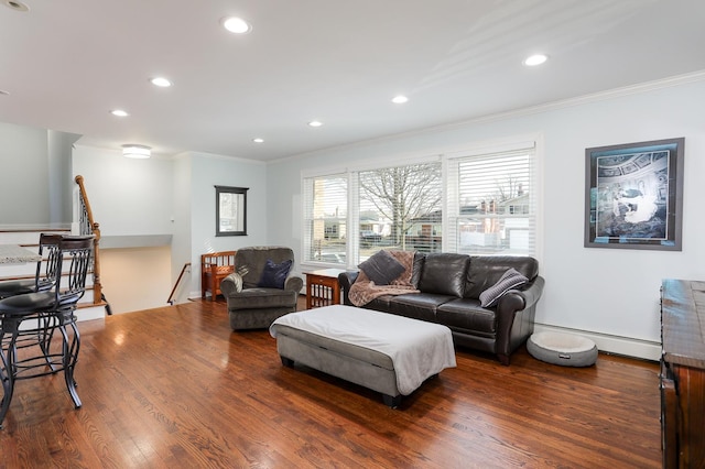 living room featuring dark hardwood / wood-style flooring, ornamental molding, and baseboard heating