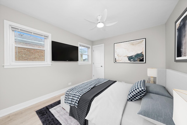 bedroom featuring ceiling fan and light hardwood / wood-style floors