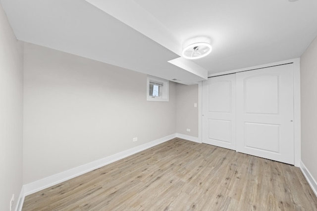 basement featuring light hardwood / wood-style floors