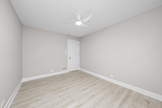 spare room featuring ceiling fan and light hardwood / wood-style floors