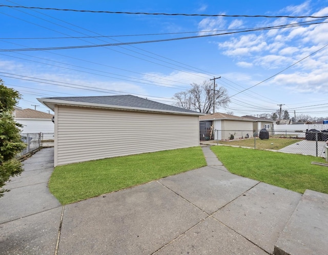 view of side of property with a patio area and a lawn