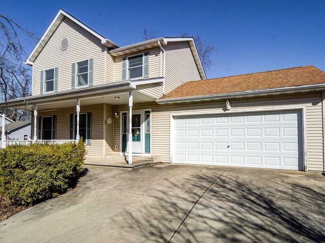 view of front of house featuring an attached garage, a porch, driveway, and roof with shingles