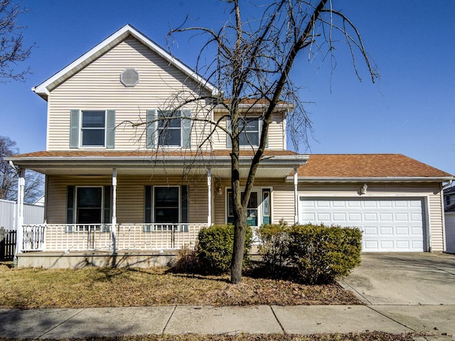 view of front facade featuring a garage, covered porch, and driveway