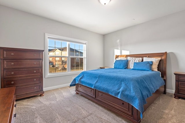 bedroom with light carpet