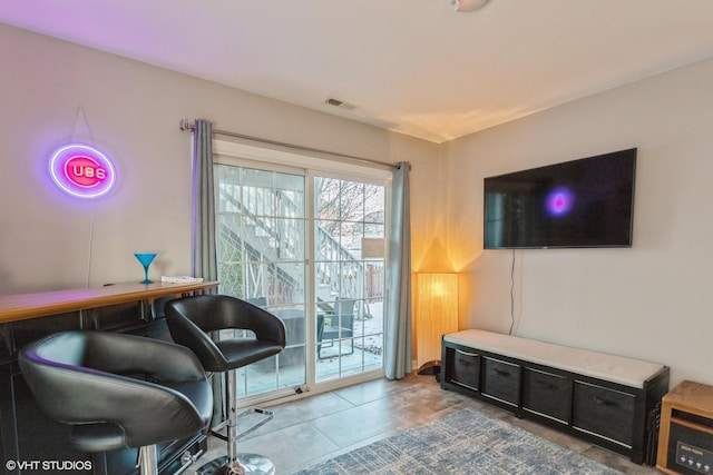 living area featuring tile patterned floors