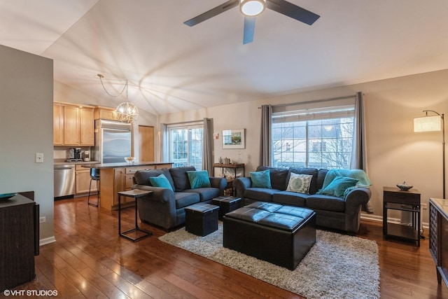 living room featuring dark hardwood / wood-style flooring, lofted ceiling, and ceiling fan with notable chandelier