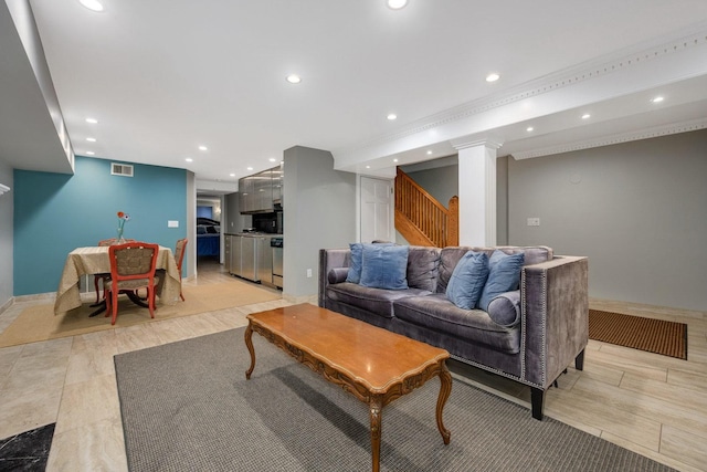 living room featuring crown molding