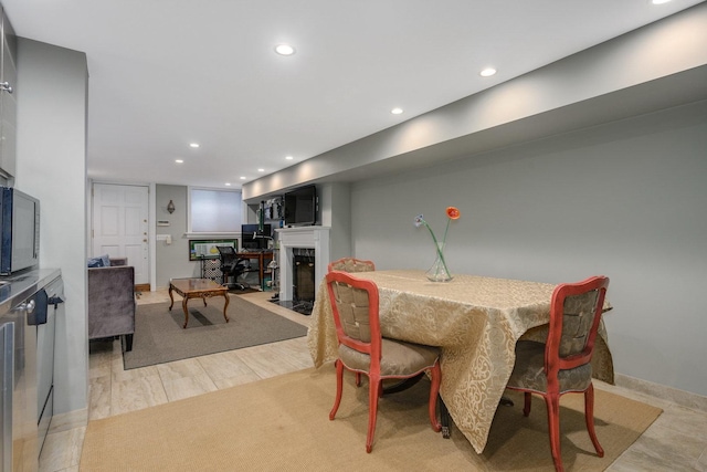 dining area with light hardwood / wood-style flooring