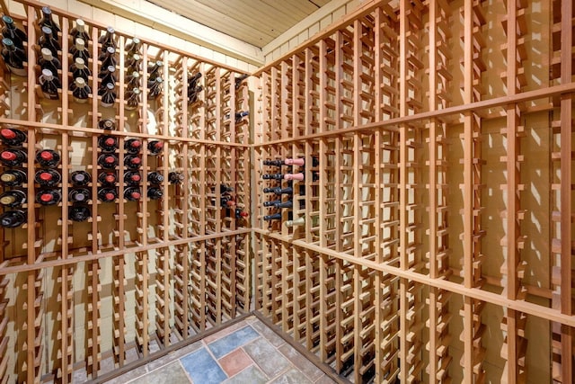 wine area featuring wood ceiling