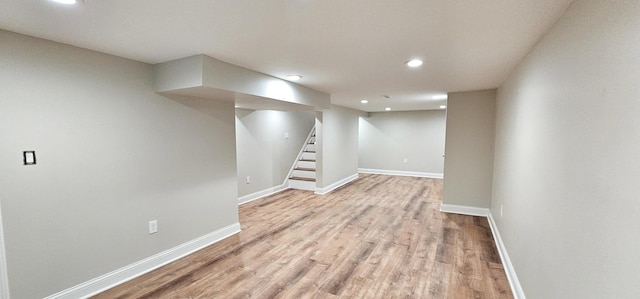 basement featuring light hardwood / wood-style floors