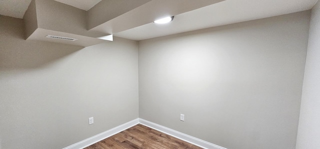 spare room with hardwood / wood-style floors