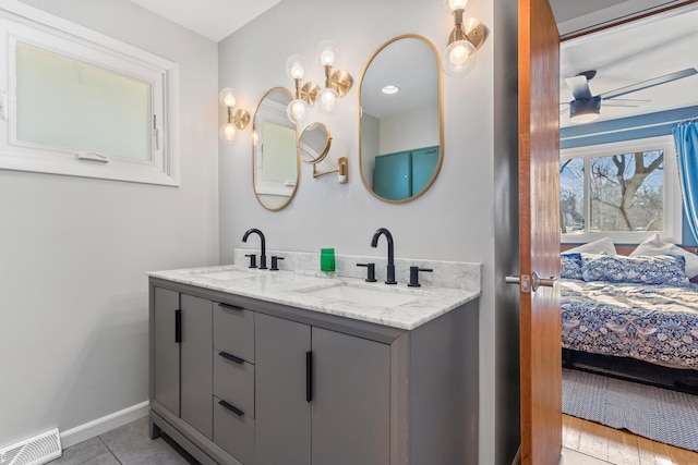 bathroom featuring vanity, tile patterned flooring, and ceiling fan