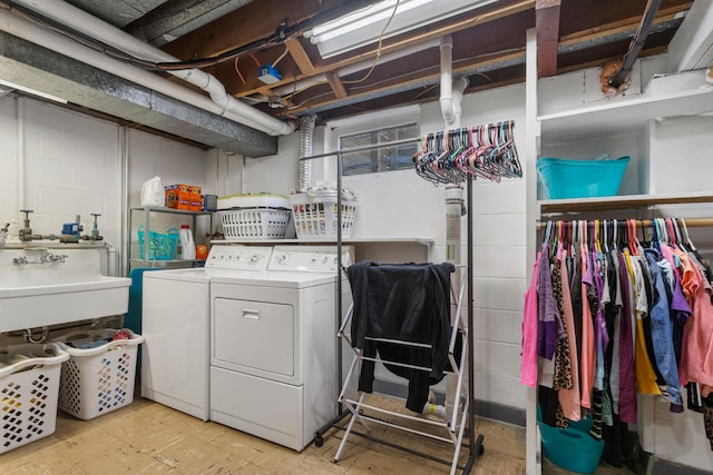 laundry room featuring sink and washer and dryer