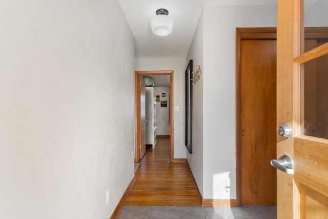 hallway featuring tile patterned floors