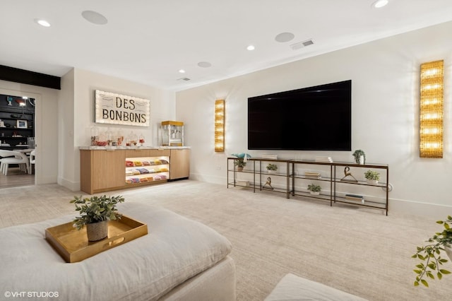 carpeted living room with bar area