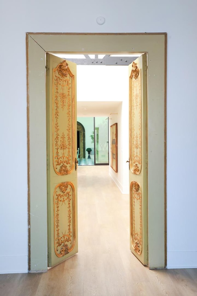 hallway with wood-type flooring