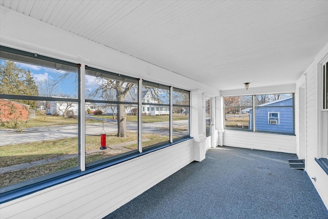 unfurnished sunroom with a wealth of natural light