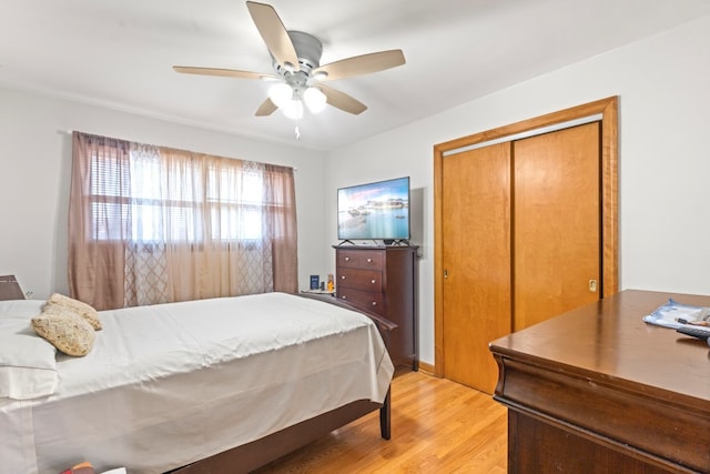 bedroom featuring a closet, ceiling fan, and light hardwood / wood-style flooring