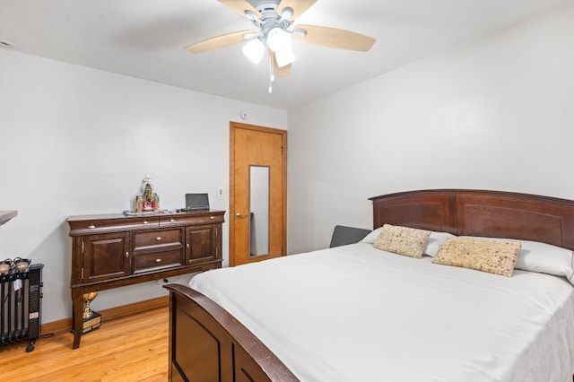 bedroom featuring ceiling fan and light hardwood / wood-style floors