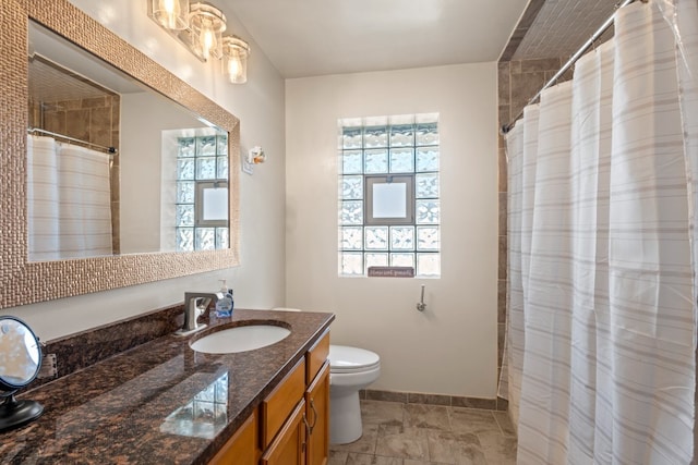 bathroom with toilet and vanity