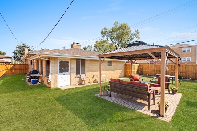 back of house with a patio area, a gazebo, a yard, and an outdoor living space